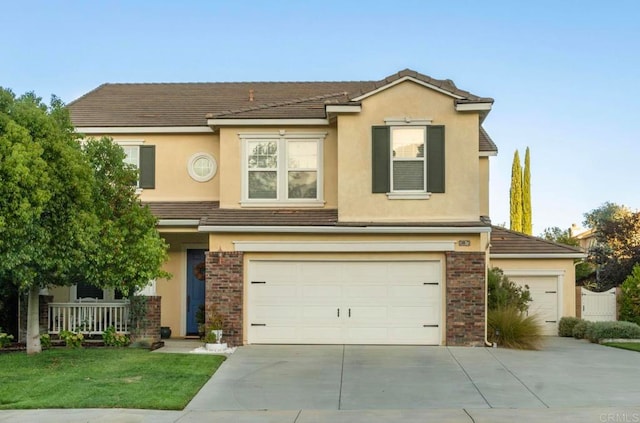 front of property with a front yard and a garage