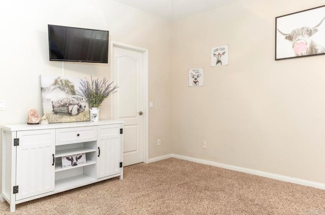 interior space featuring light colored carpet