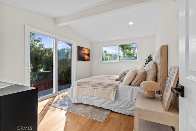 bedroom with hardwood / wood-style flooring, access to exterior, and lofted ceiling with beams