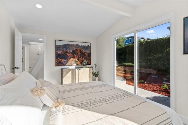 bedroom with vaulted ceiling with beams