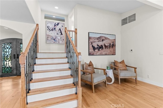 stairs with wood-type flooring