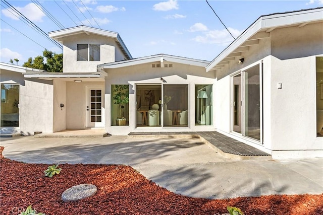 rear view of property featuring a patio