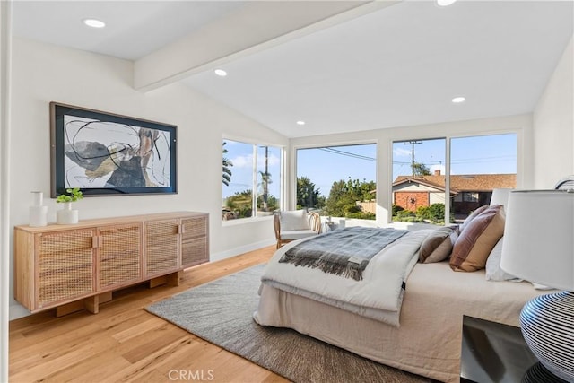 bedroom with wood-type flooring and lofted ceiling with beams