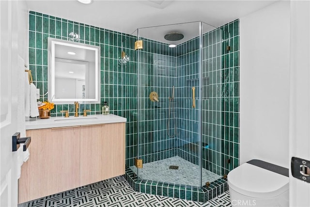 bathroom with vanity, toilet, an enclosed shower, and tile walls