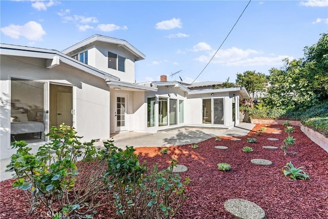 rear view of house featuring a patio