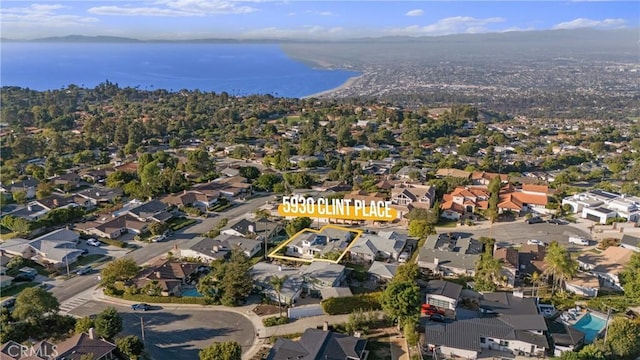 bird's eye view with a residential view and a water view