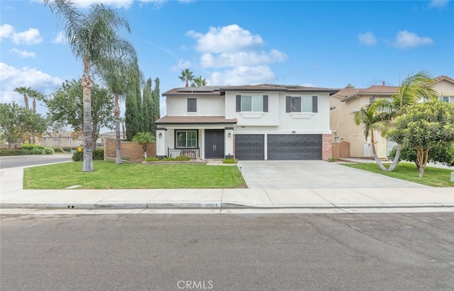 view of front of property featuring a front yard and a garage