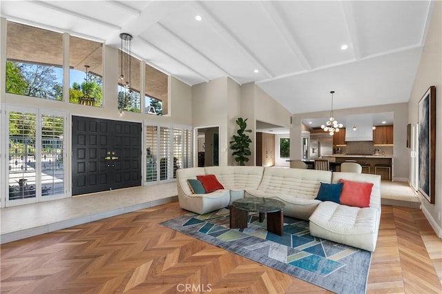 living room with an inviting chandelier, beamed ceiling, high vaulted ceiling, and light parquet floors