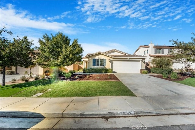 view of front of property with a garage and a front lawn