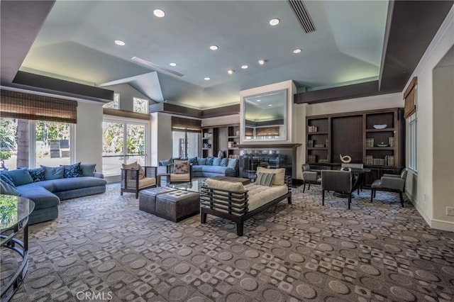 carpeted living room featuring a raised ceiling