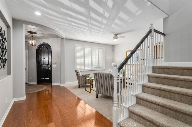 entryway with ceiling fan and hardwood / wood-style floors