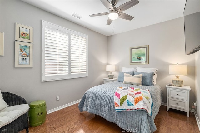 bedroom with ceiling fan and dark hardwood / wood-style floors