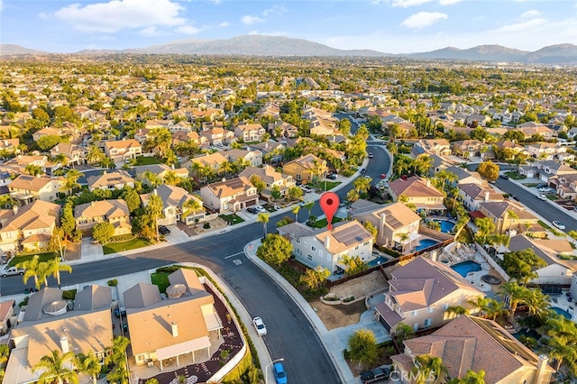 birds eye view of property with a mountain view