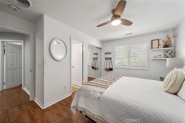 bedroom with ceiling fan and dark wood-type flooring