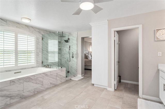 bathroom featuring independent shower and bath, vanity, and ceiling fan