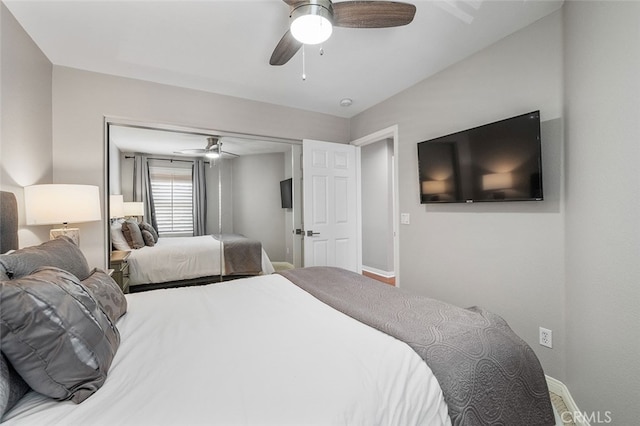 bedroom with ceiling fan and a closet