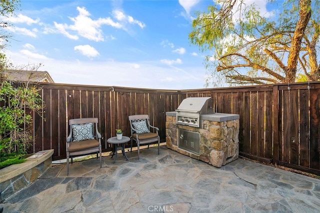 view of patio with a grill and exterior kitchen