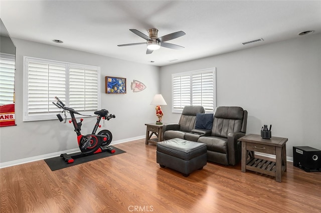 interior space with ceiling fan and hardwood / wood-style floors