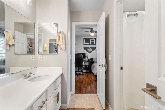 bathroom featuring ceiling fan, tile patterned flooring, and vanity