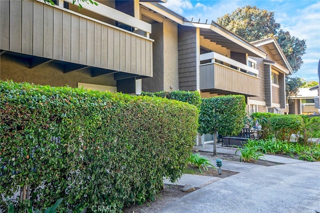 view of home's exterior with a balcony