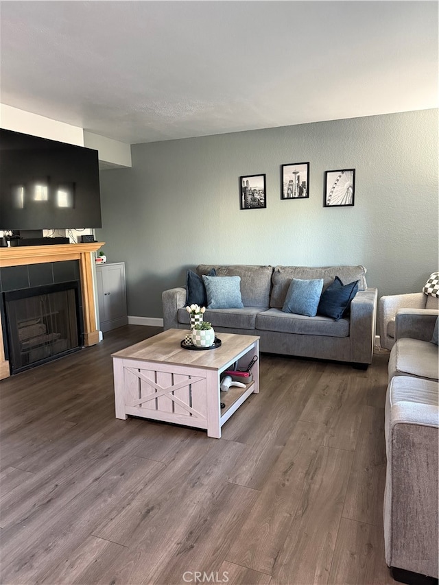 living room featuring dark wood-type flooring