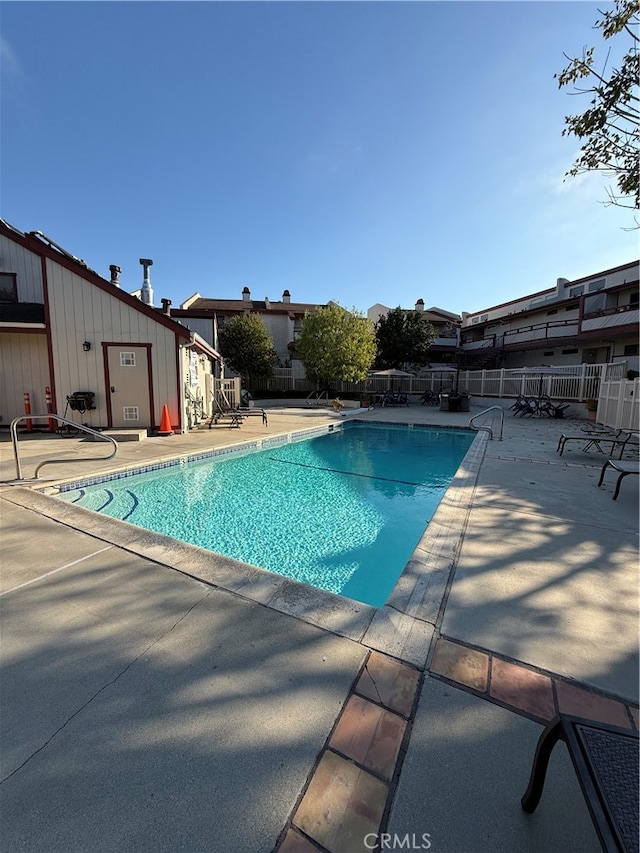 view of pool featuring a patio