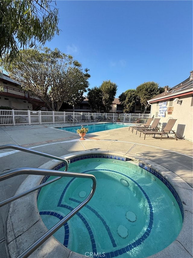 view of pool featuring a patio area