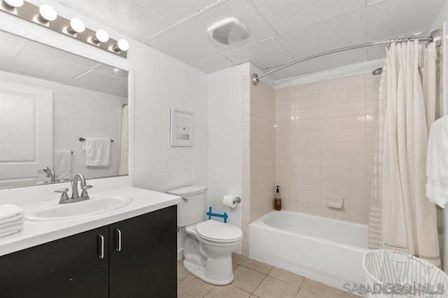 full bathroom with shower / tub combo, tile patterned floors, vanity, and toilet