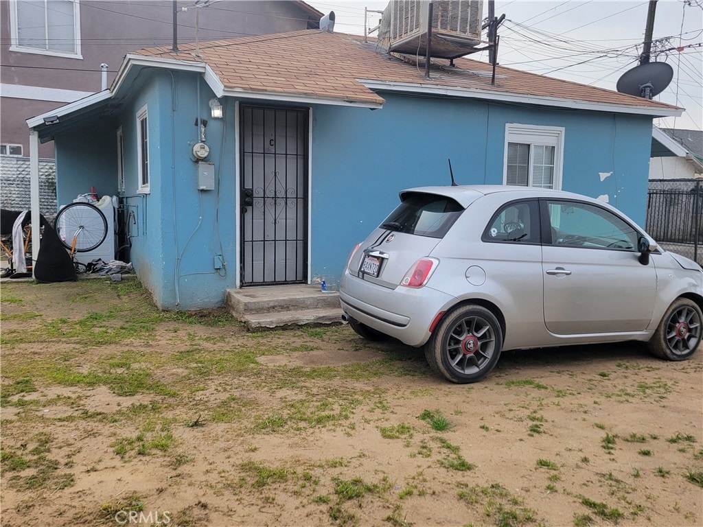 view of property exterior with central AC