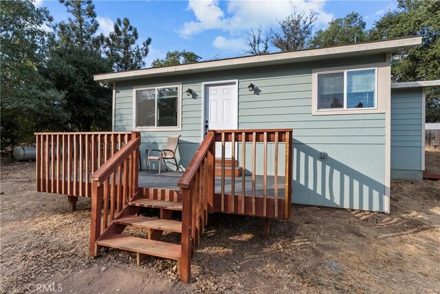 exterior space featuring a wooden deck