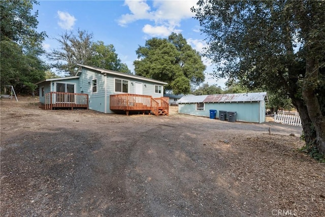 view of front of house featuring a wooden deck