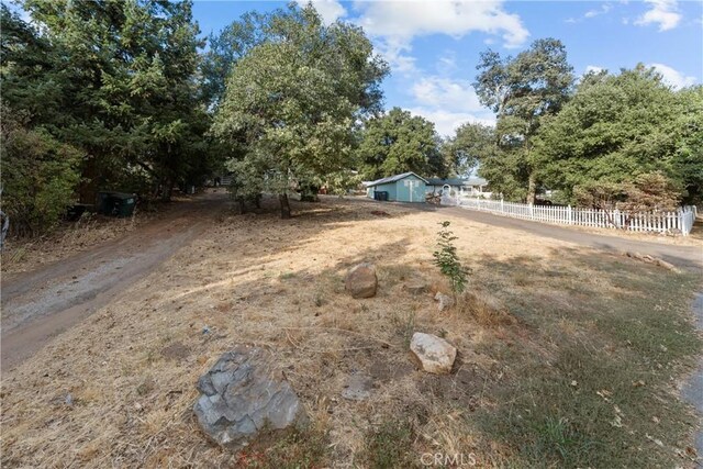 view of yard with a rural view