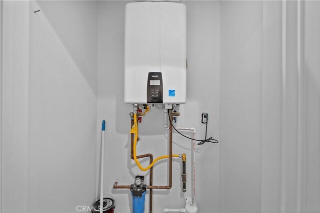 utility room with water heater