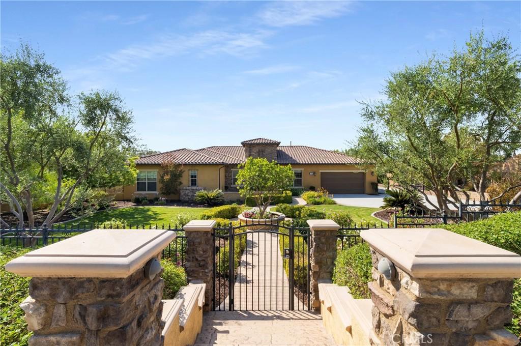 mediterranean / spanish home with a garage