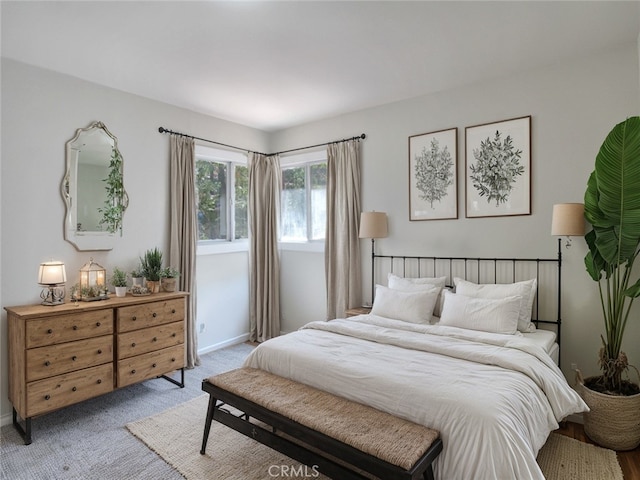 bedroom with light colored carpet