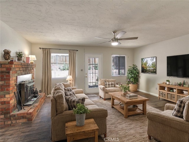 living room featuring a textured ceiling, ceiling fan, and hardwood / wood-style flooring