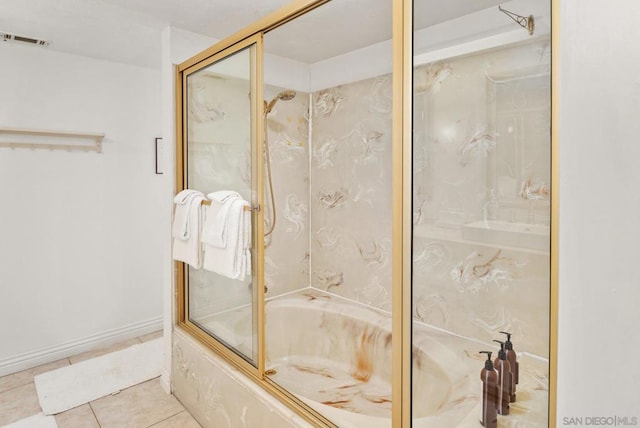 bathroom with enclosed tub / shower combo and tile patterned floors