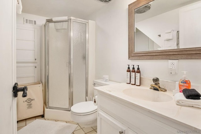 bathroom with vanity, a shower with shower door, toilet, and tile patterned flooring