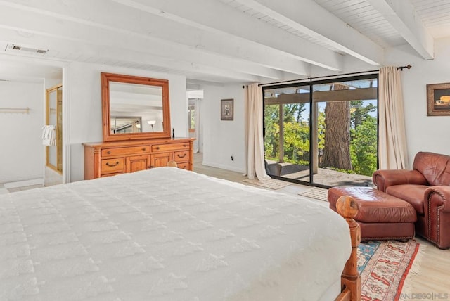 bedroom featuring light wood-type flooring, beam ceiling, and access to exterior