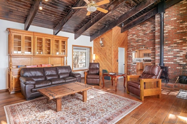 living room featuring wooden ceiling, wood-type flooring, beam ceiling, and ceiling fan