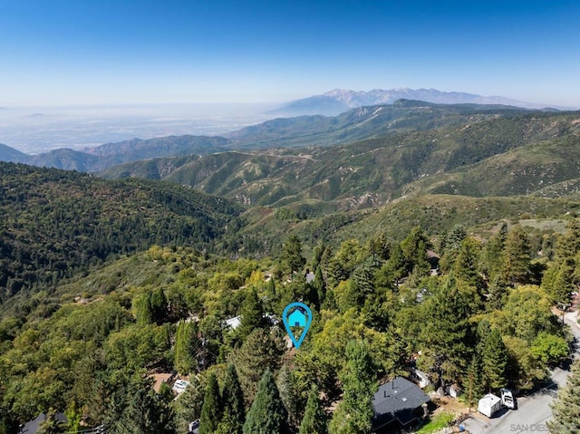 birds eye view of property with a mountain view