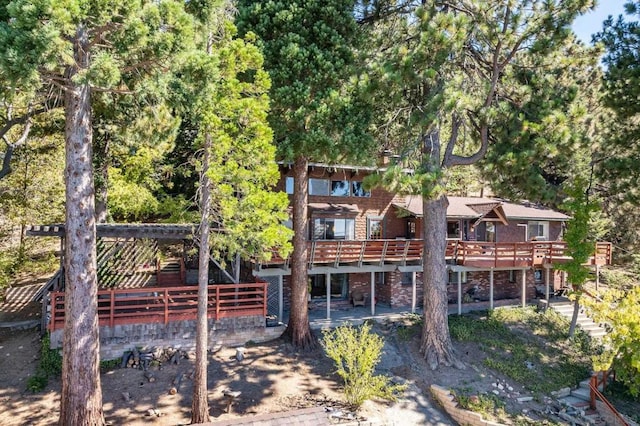 back of house featuring a deck