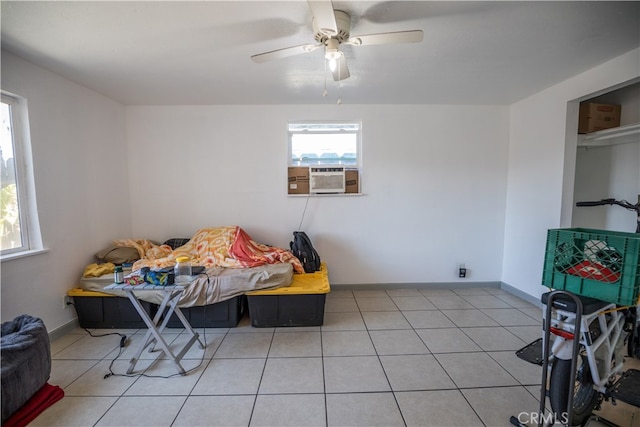 tiled bedroom with cooling unit and ceiling fan