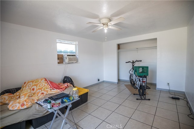 unfurnished room with cooling unit, tile patterned flooring, and ceiling fan