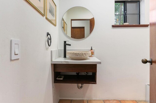 bathroom featuring tile patterned floors and vanity