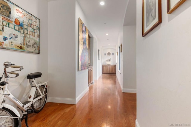 corridor featuring hardwood / wood-style floors