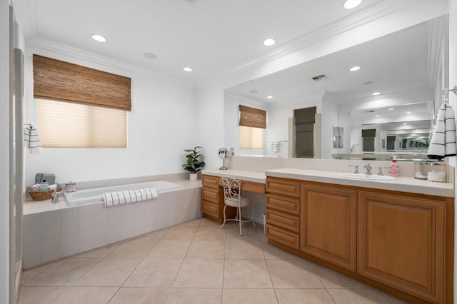 bathroom featuring tile patterned floors, vanity, ornamental molding, and tiled tub