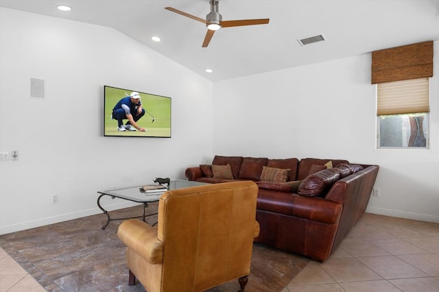 tiled living room featuring ceiling fan and lofted ceiling