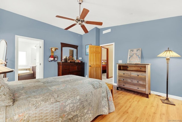 bedroom featuring light hardwood / wood-style flooring, connected bathroom, and ceiling fan