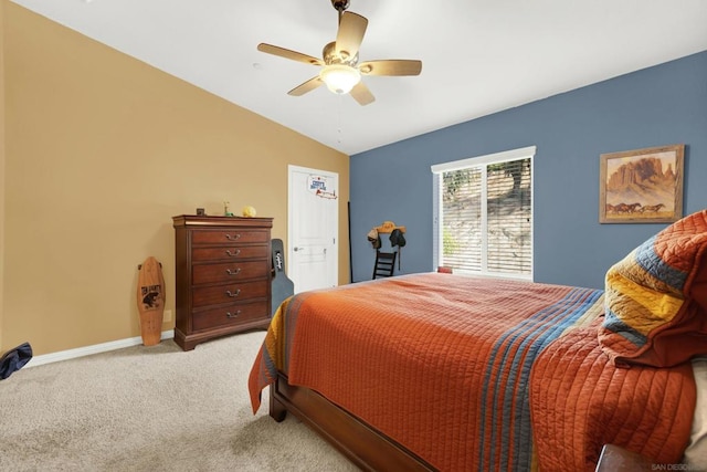 carpeted bedroom with lofted ceiling and ceiling fan